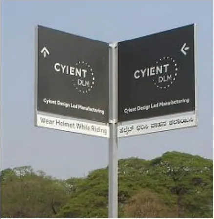 Two-sided illuminated directional sign for an industrial campus with English and Kannada text