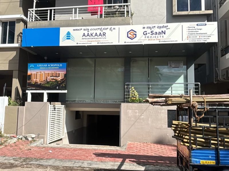 Office fascia board above a ground-floor frontage, with company names