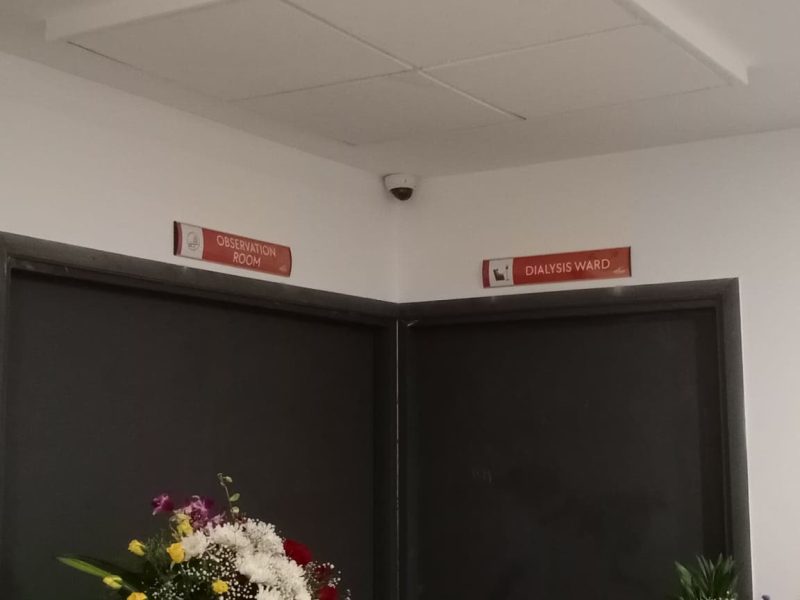 Red door-head signs reading Observation Room and Dialysis Ward