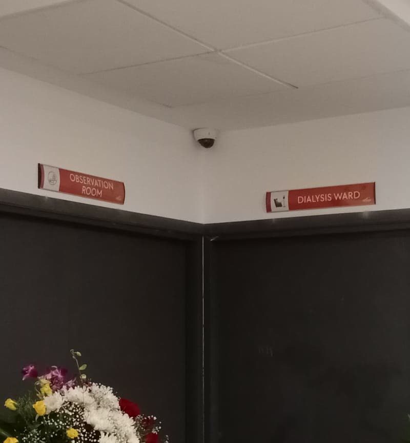 Red door-head signs reading Observation Room and Dialysis Ward
