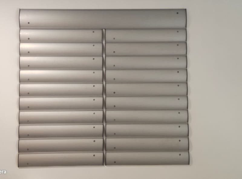 Aluminium modular directory with blank slats, fixed to a wall