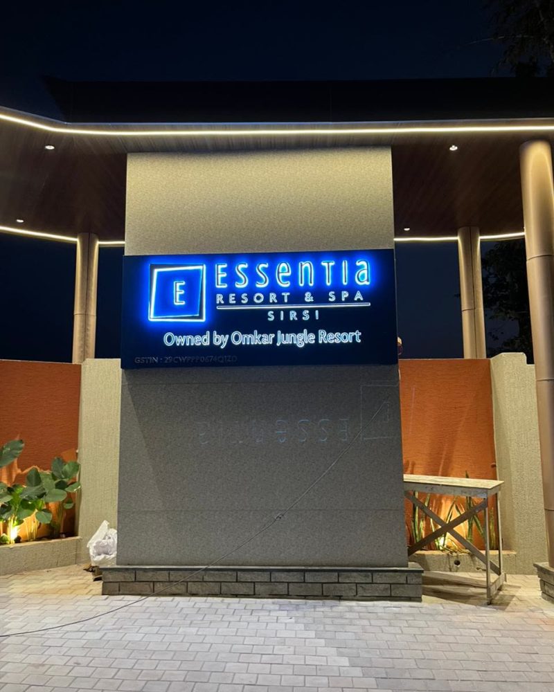 Essentia Resort and Spa, Sirsi, sign in English lit blue at night