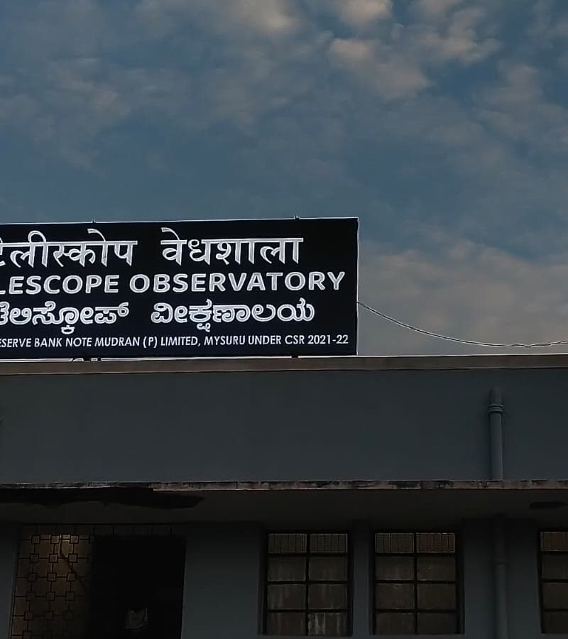 Telescope Observatory board on the roof of a building, by day