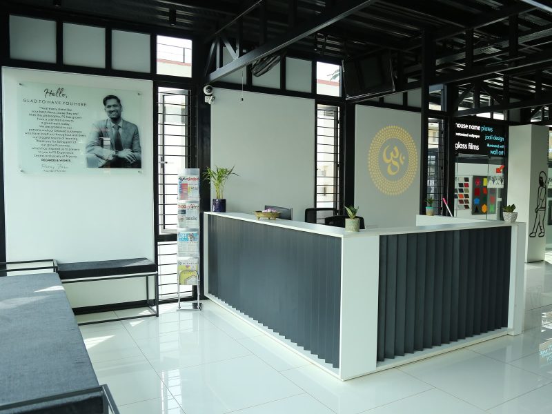 Reception counter on the ground floor, with sample boards beyond it